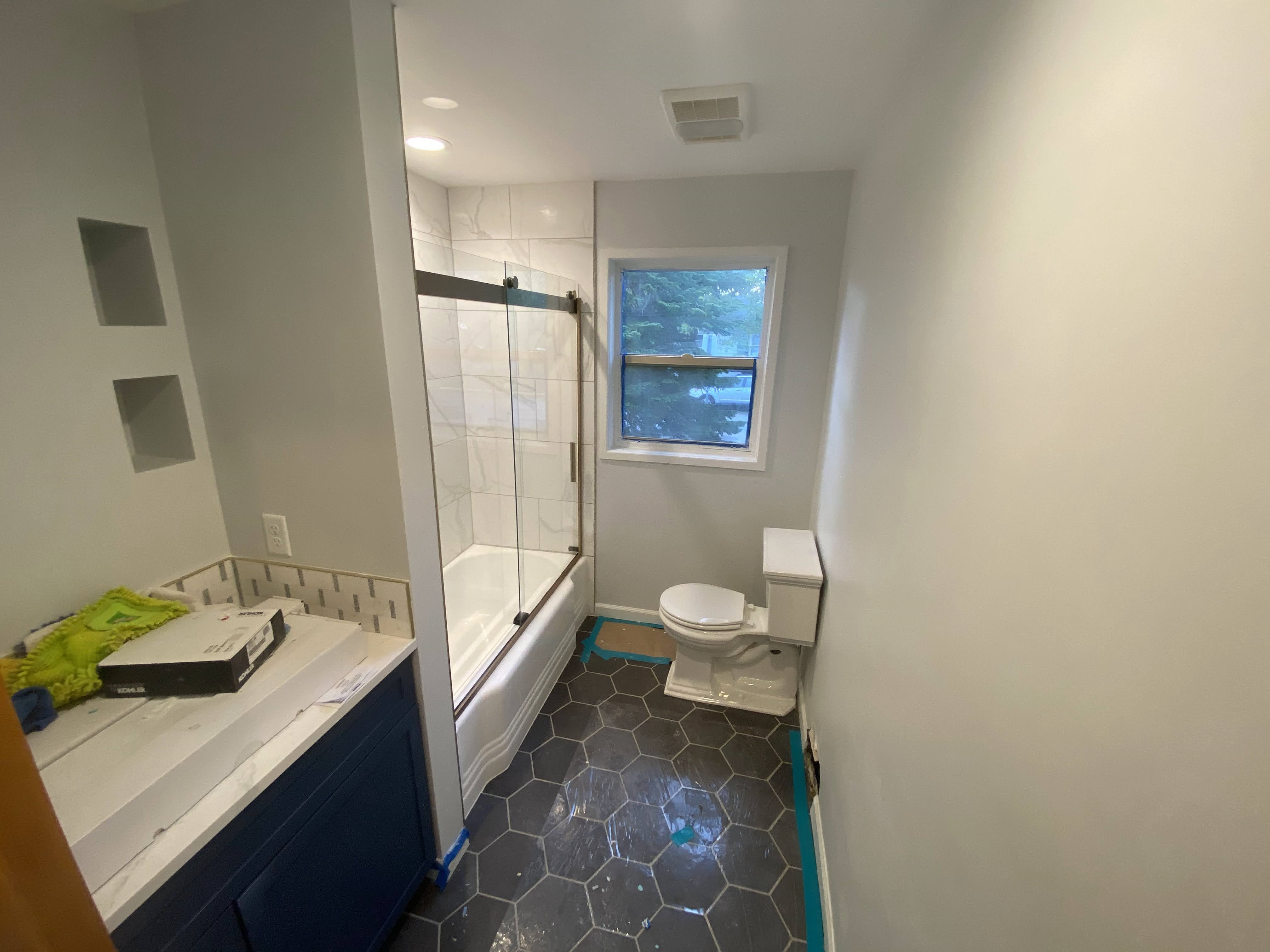 completed bathroom tub tile surround