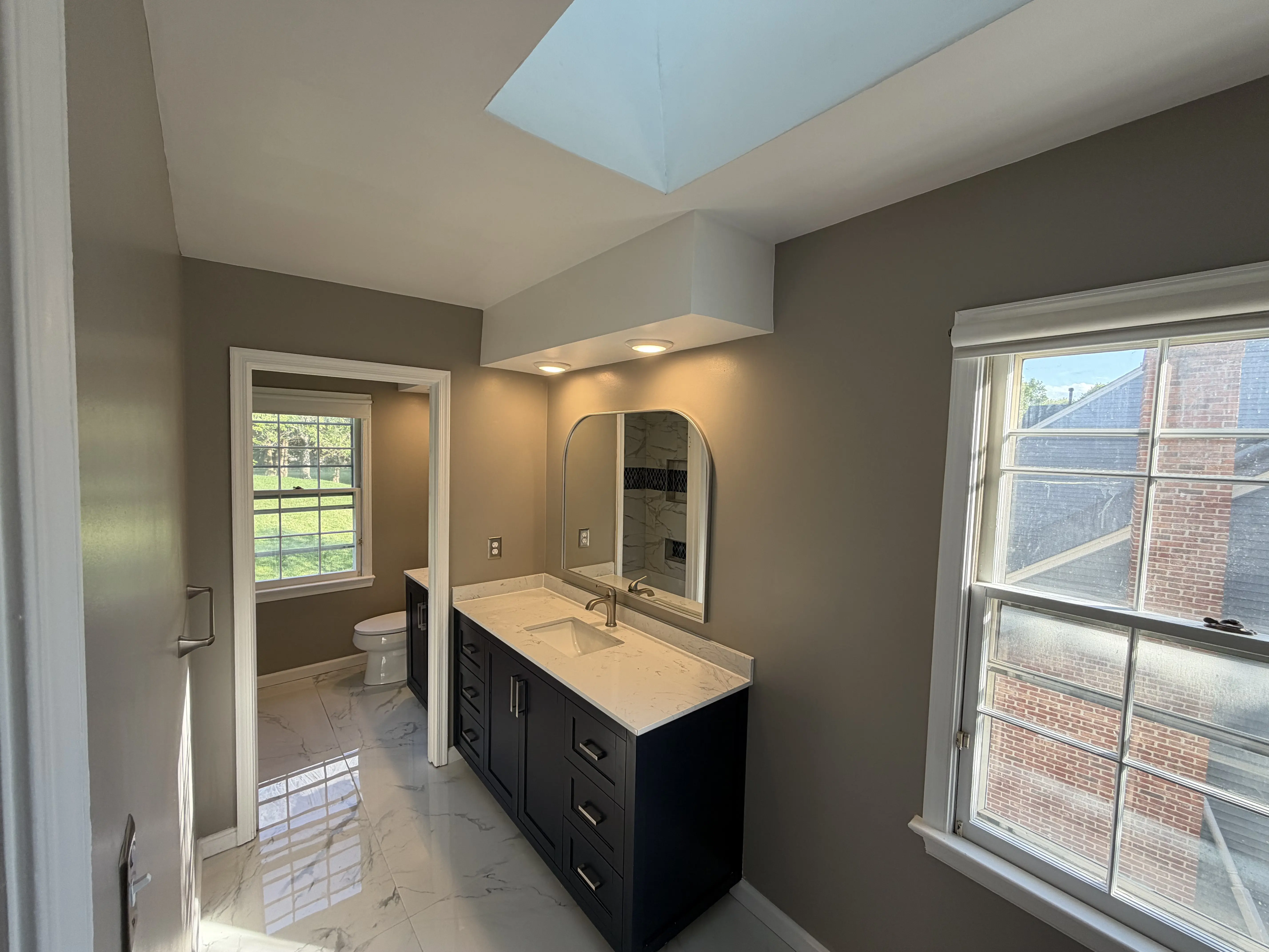 navy vanity skylight hallway 02